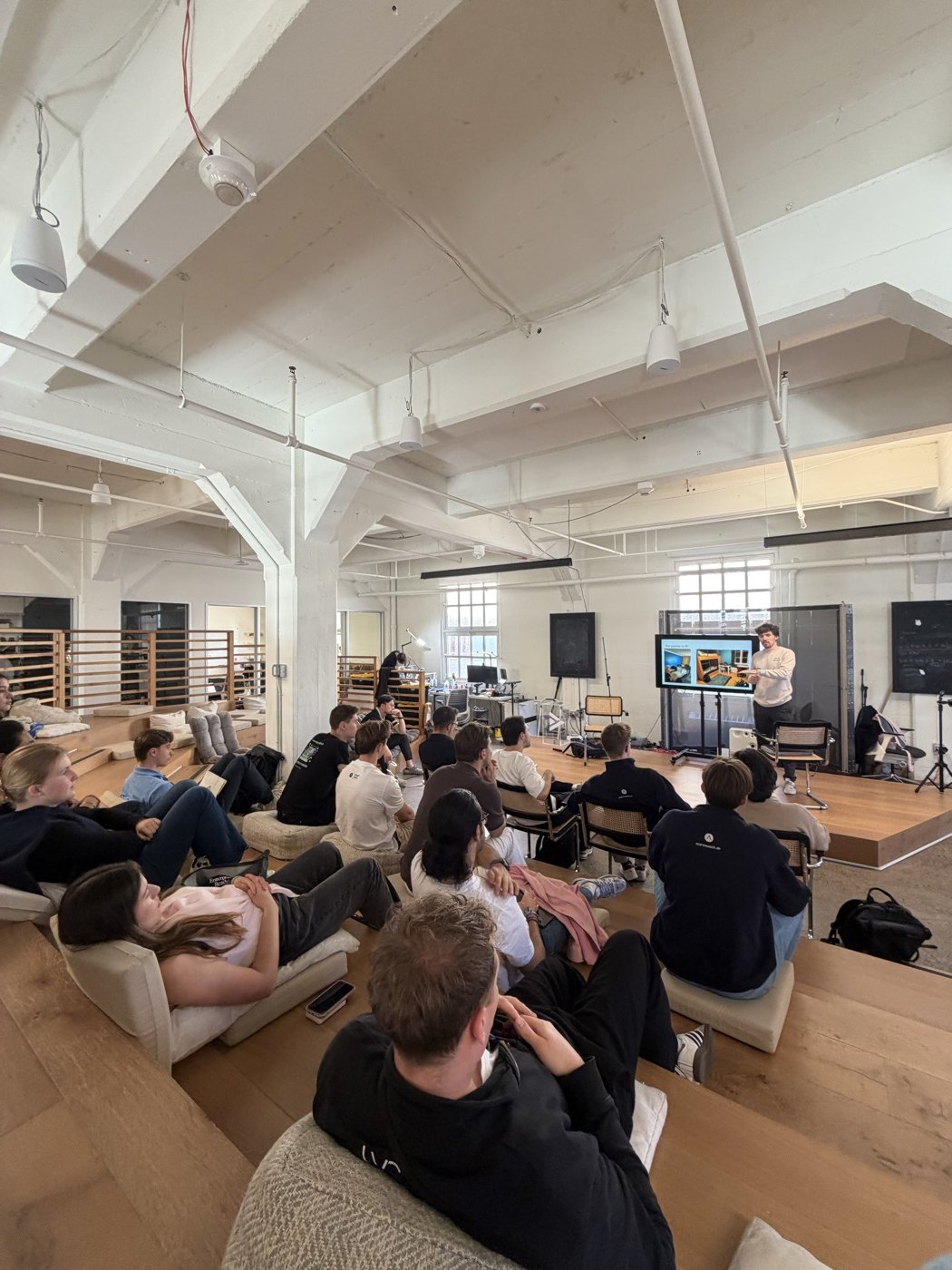 The group listening to a presentation